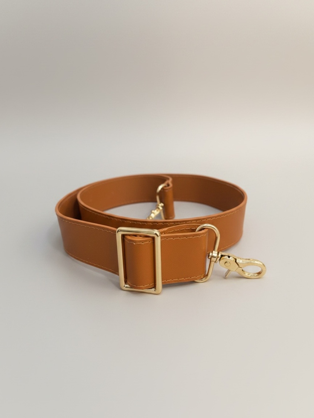 Tan and Gold Toned Guitar Purse Strap